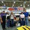 The Slinger Super Speedway trophy girl stops by. Dave, Andy, and Theresa hope to see her again soon, after the checkered flag!