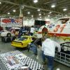 A prospective new driver checks out the interior of the #31 Mick Ellis car